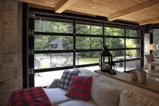 This full-view garage door is in the California, 18' x 8', Black aluminum frame, Clear glass.